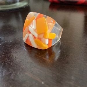 Orange and white pill ring